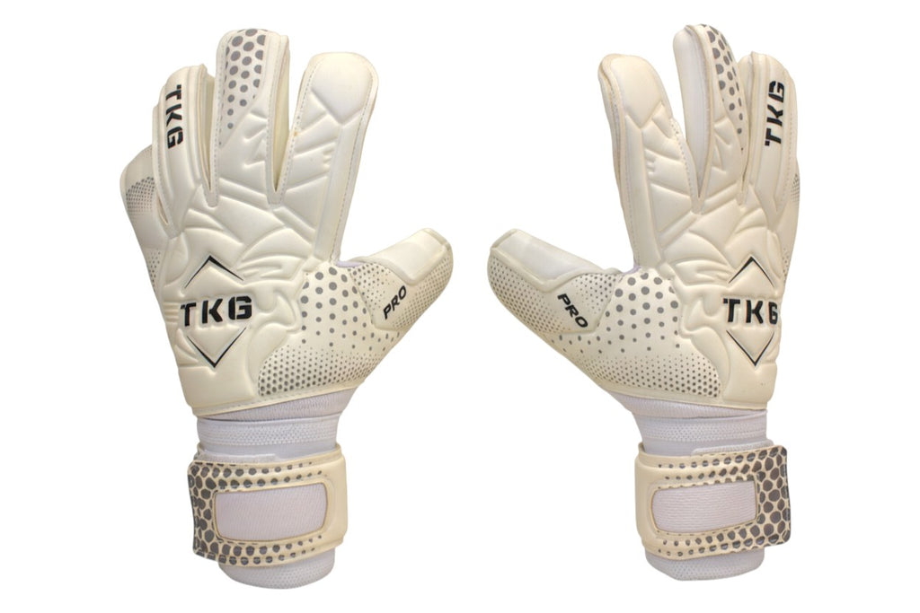 TOTAL KEEPERS GOTI PRO white latex goalkeeper gloves with negative roll cut and reinforced finger spines for added protection.